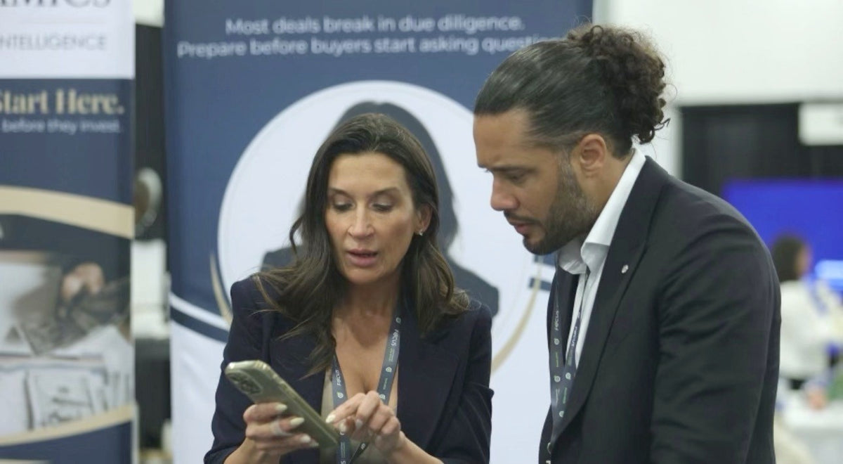 Tiffany speaking with an attendee at a business show